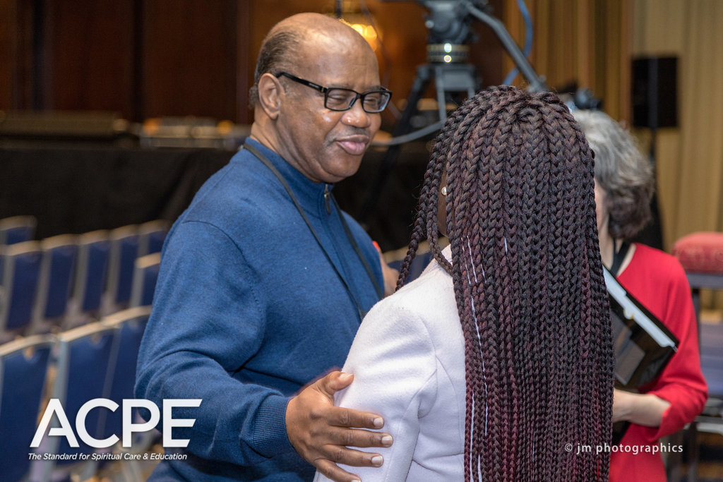 Carlos R. Bell interacting with ACPE members
